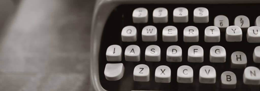 INT stands for blog_closeup of typewriter_black and white