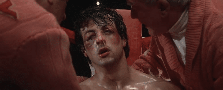 Rocky looking beat the heck up after being defeated at the end of Rocky.
